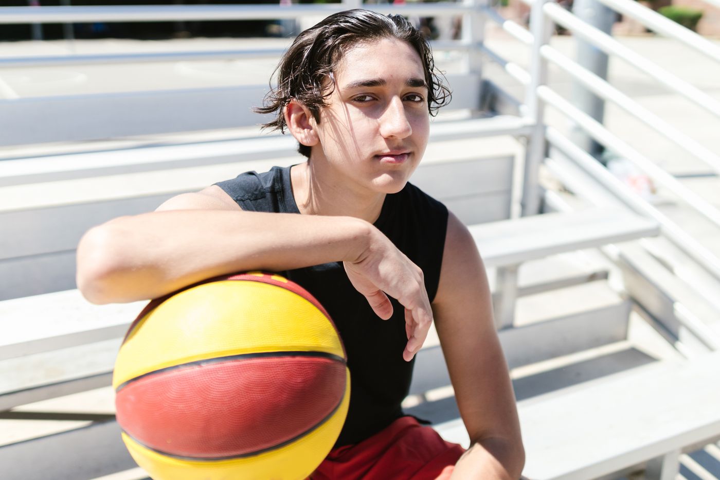 Player resting courtside on the bleachers — photo by RDNE Stock project on Pexels