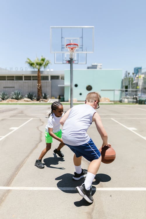 Two Boys Playing Basketball