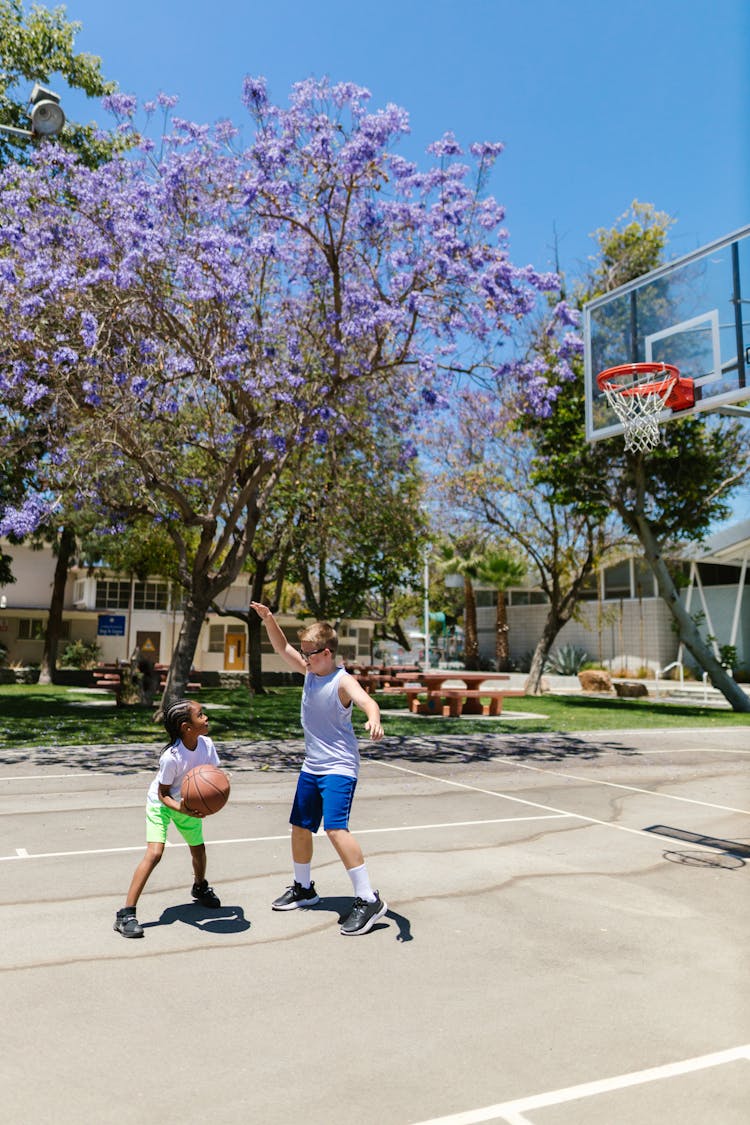 Two Boys Playing Basketball