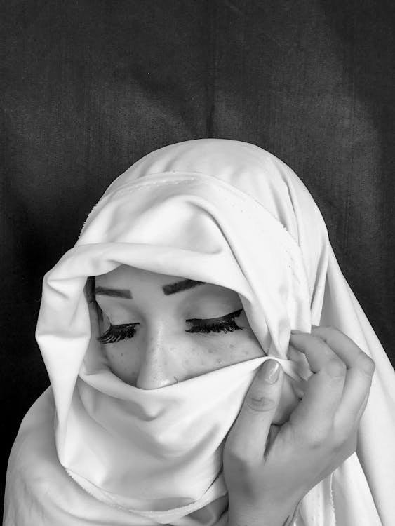 Person Wearing White Hijab Covering Face · Free Stock Photo