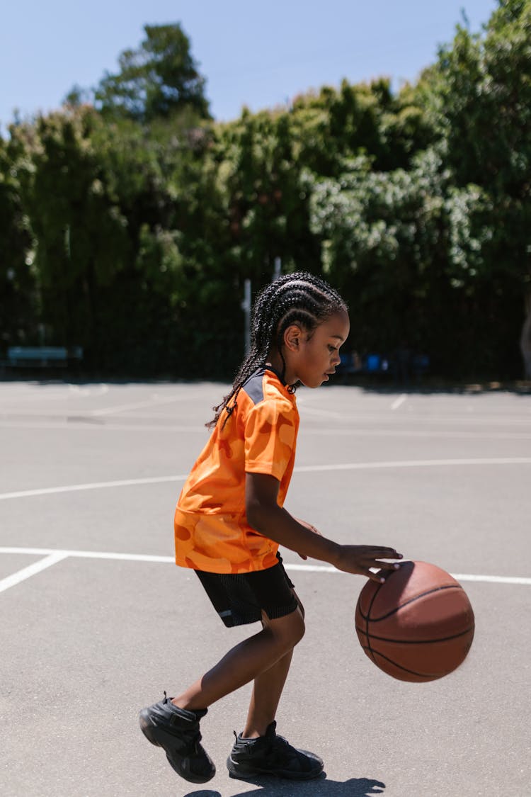 A Boy Playing Basketball