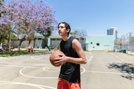 Woman in Black Tank Top Holding Basketball