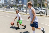 Boys Playing Basketball on Court