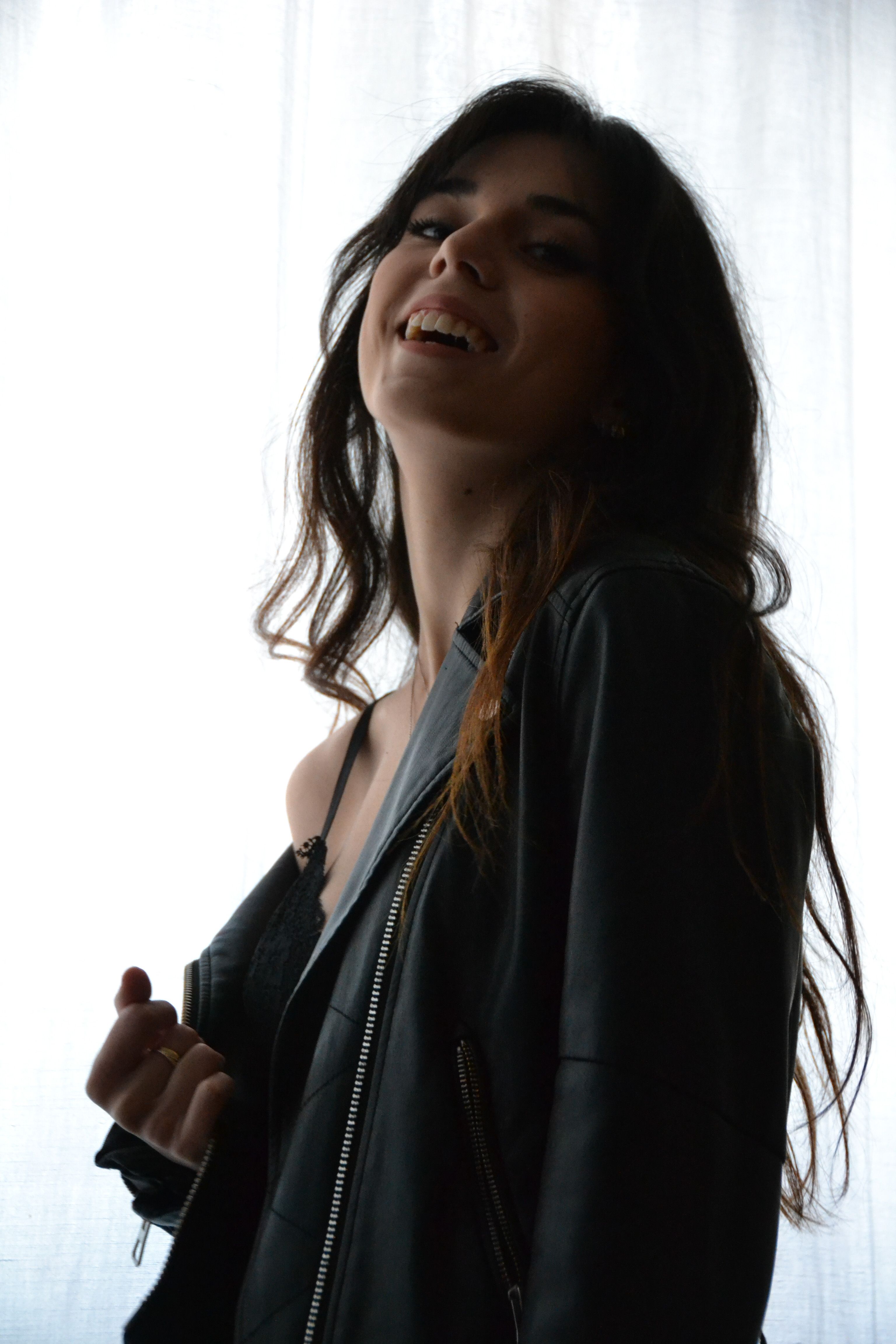 Woman in Black Leather Jacket Smiling · Free Stock Photo
