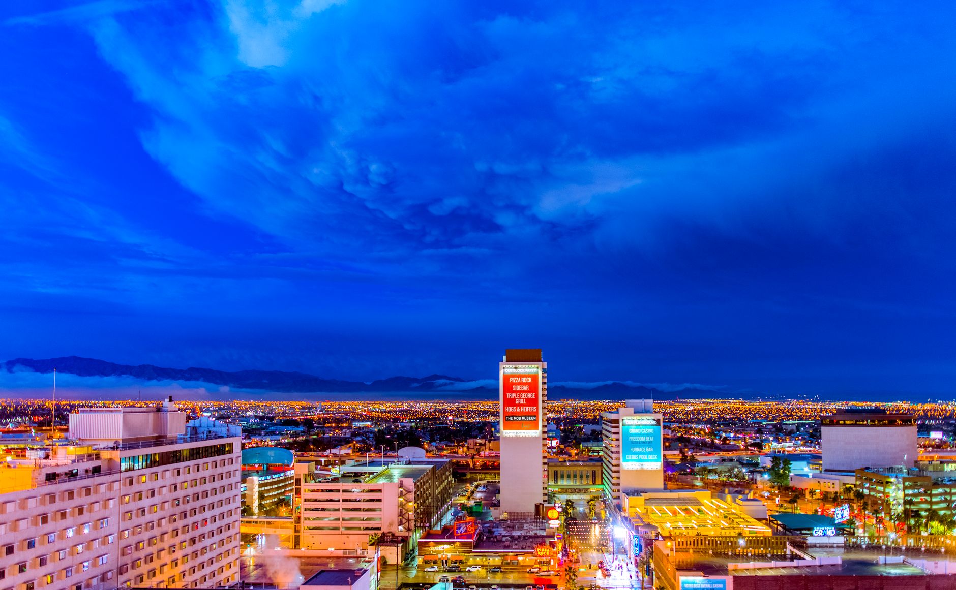 A stunning view of the illuminated Las Vegas skyline at night showcasing vibrant city lights.