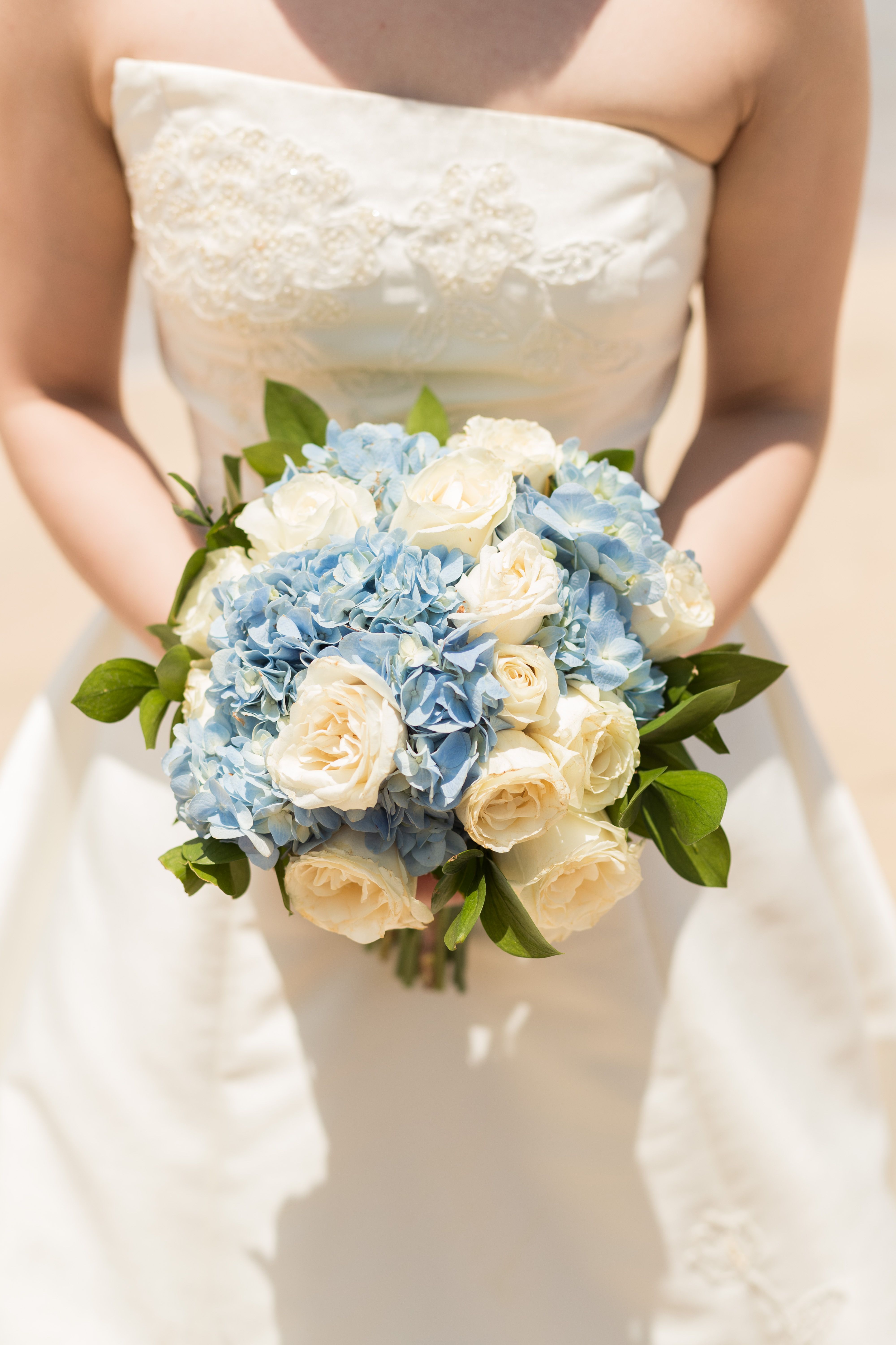 Woman in White Wedding Dress Holding Bouquet of Flowers · Free Stock Photo