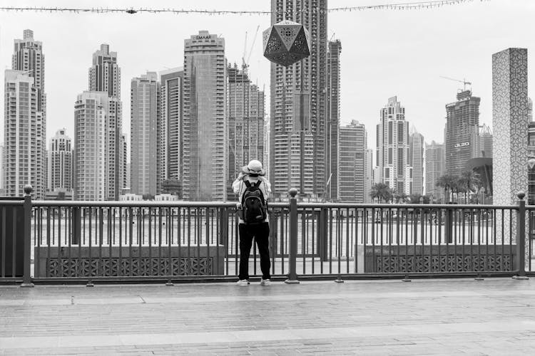 A Person Taking A Photograph Of The Dubai Skyline