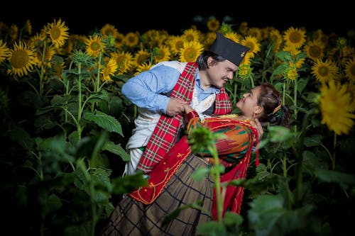Free Couple in Sunflower Field Stock Photo