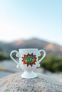 White Ceramic Mug on Brown Wooden Table