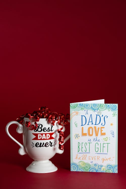 Ceramic Trophy Mug Beside a Father's Day Cad