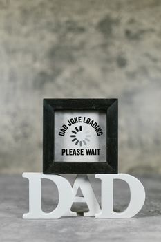 Black wooden frame with a humorous dad joke for Father's Day gifts. — photo by RDNE Stock project