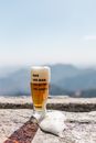 Clear Drinking Glass With Beer on Brown Sand