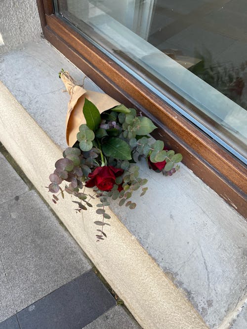 Bouquet of Roses on Window Sill