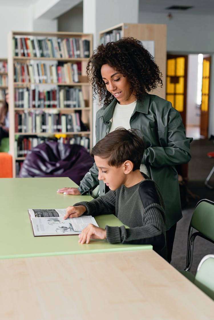 Teacher And Student In A Library