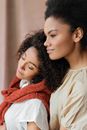 Woman in Red Scarf Beside Woman Smiling