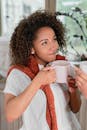 Woman in White Shirt Holding White Ceramic Mug