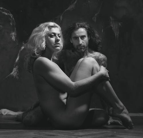 A Nude Man and a Woman Sitting on the Floor