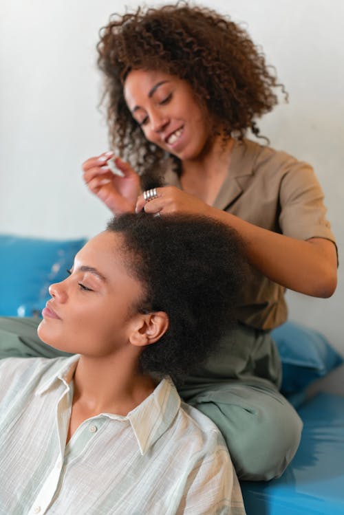 Free Woman Fixing Her Partner's Hair Stock Photo