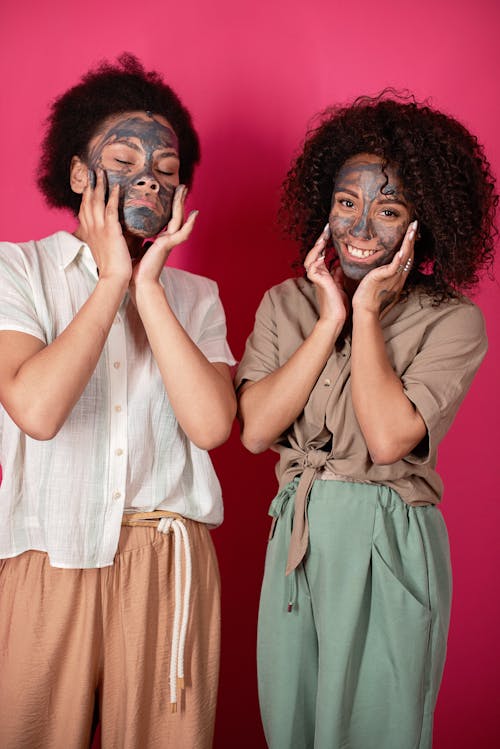 Two Women with Black Facial Mask 