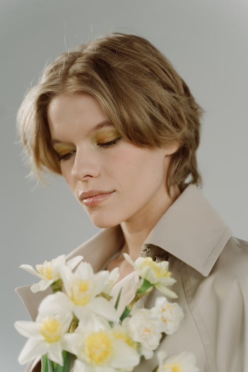 Close-Up Photo of Woman holding White Flower