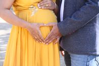 A Couple Hands over Their Baby Bump