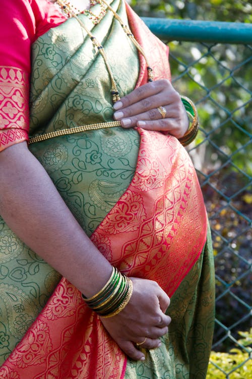 Free A Pregnant Woman in Traditional Wear Stock Photo
