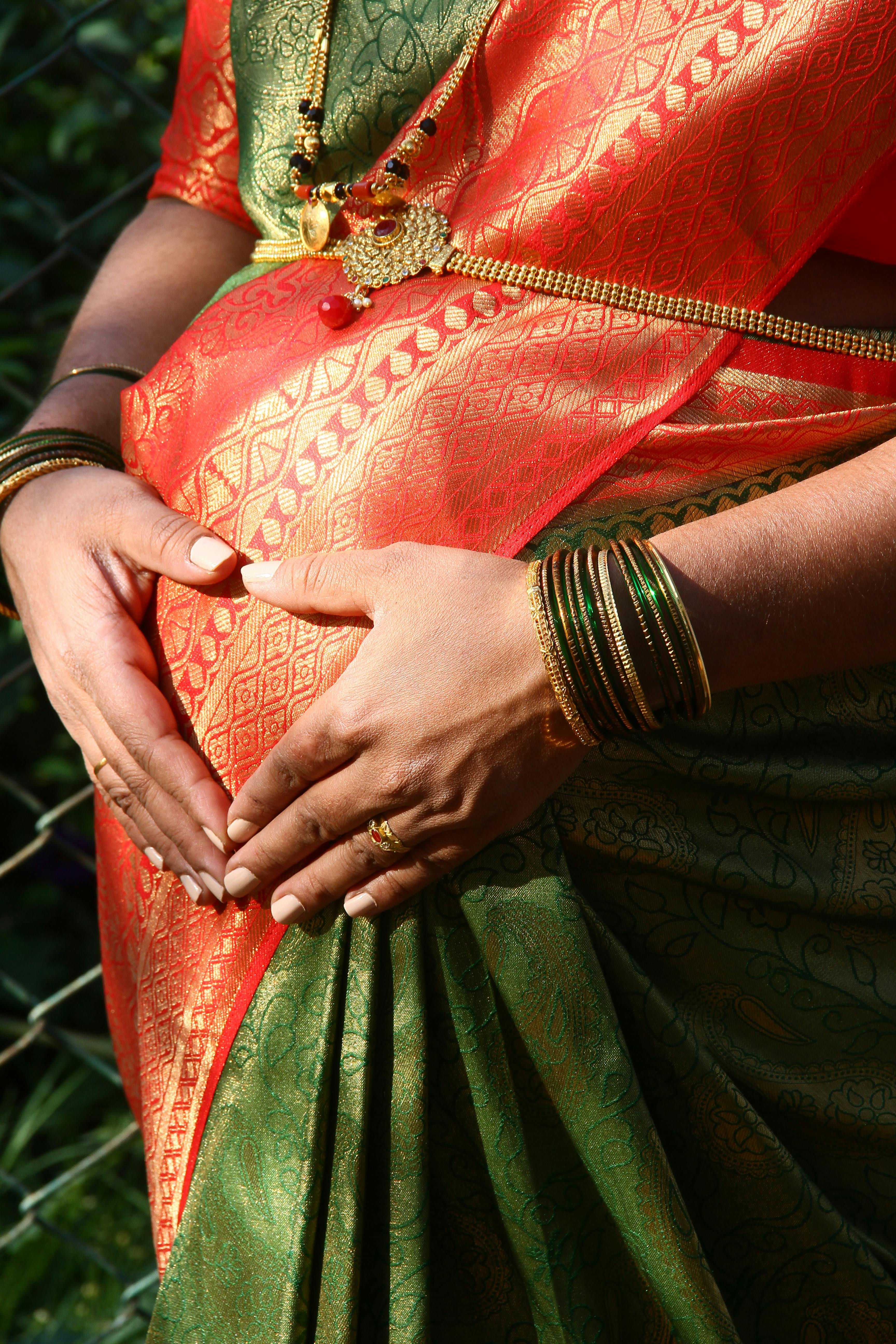 A Pregnant Woman in Traditional Wear · Free Stock Photo