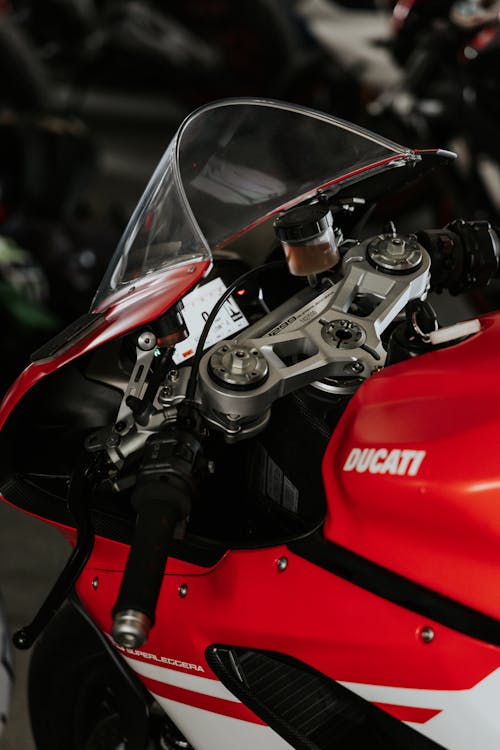 Close-Up Shot of  a Red and Black Motorcycle