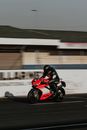 Man Riding Red Sports Bike