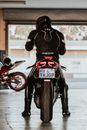 Man in Black and Red Motorcycle Suit Riding Motorcycle