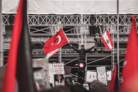 People in a Market With Flags