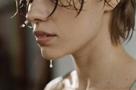 Woman in White Shirt Wearing Black Framed Eyeglasses