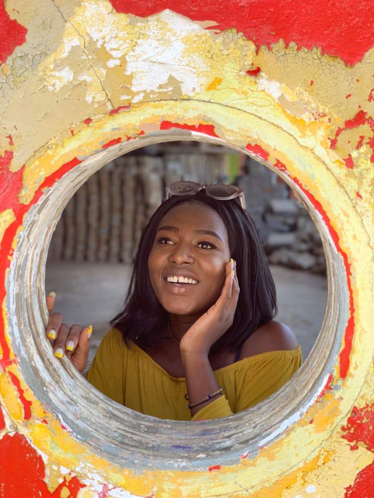 A Woman Behind A Round Window