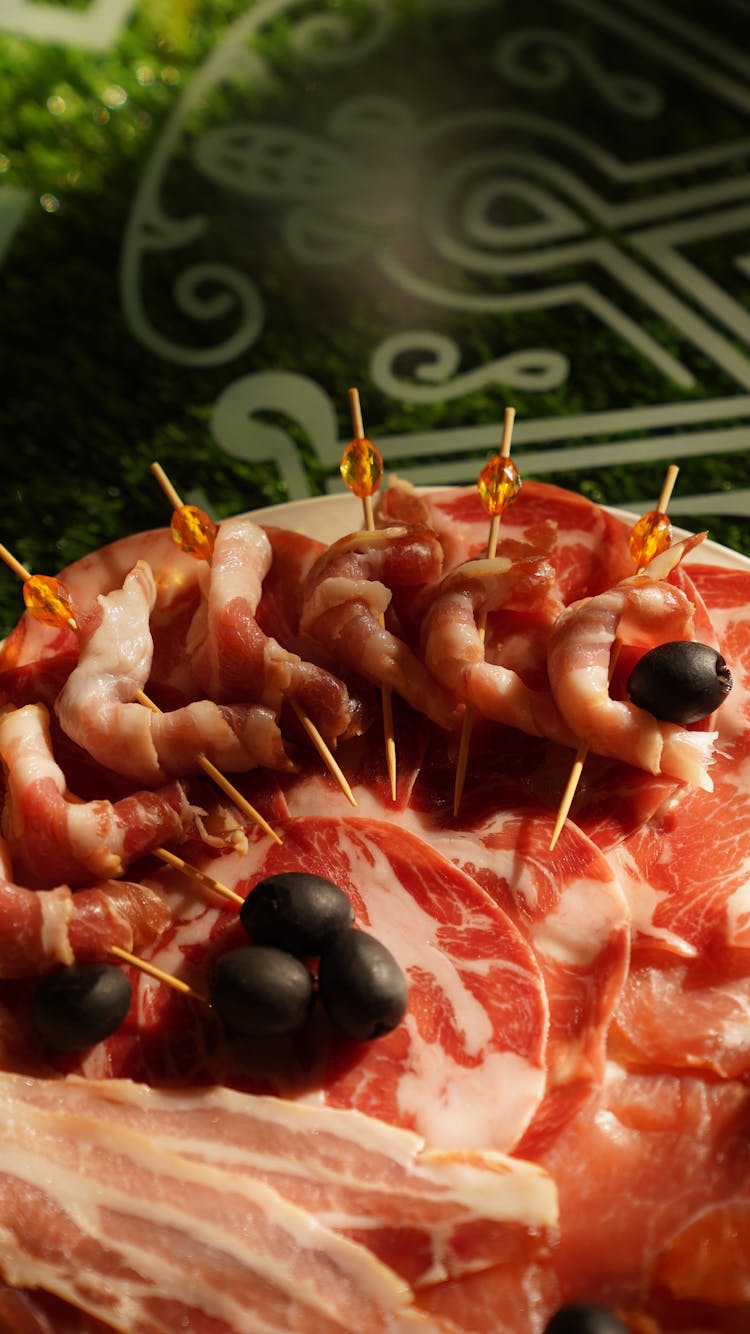 An Olives And Prosciutto On A Platter