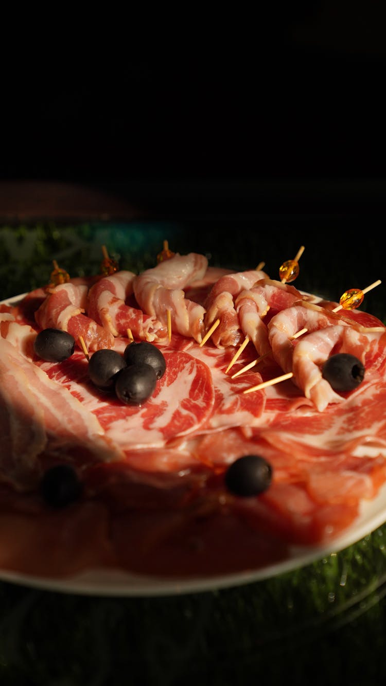 A Prosciutto And Olives On A Platter