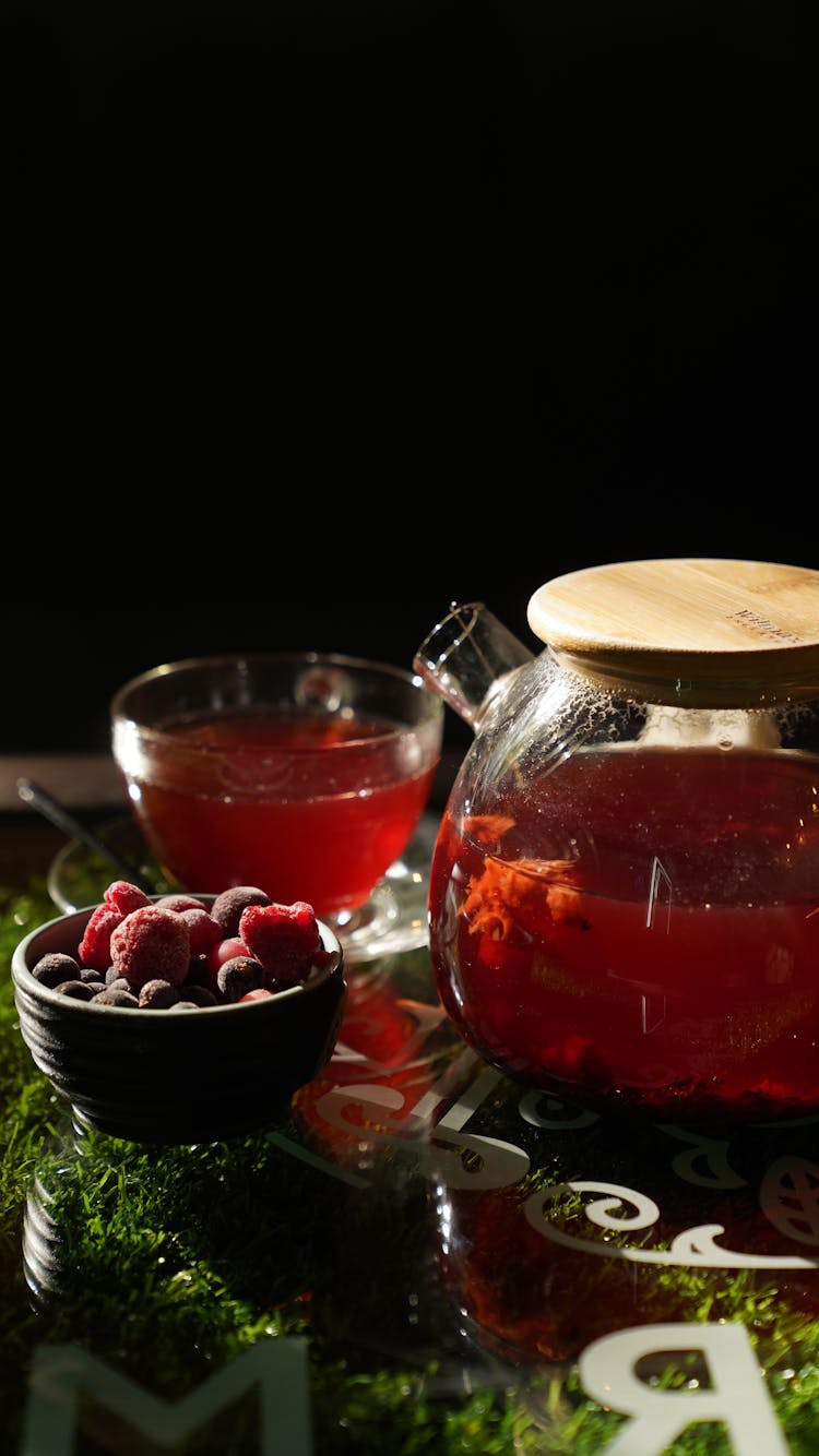 Raspberry Fruit Juice In Clear Glass Jar And Cup