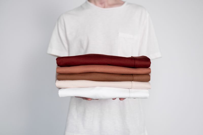 Neutral-tone folded apparel stack for branded corporate clothing