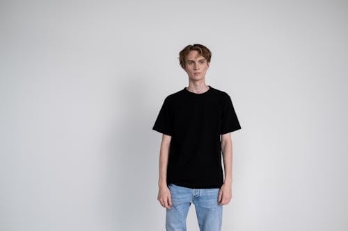 Man in Black Crew Neck T-shirt and Blue Denim Jeans