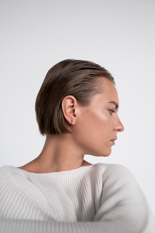 Free Close-Up Shot of a Woman in White Sweater  Stock Photo