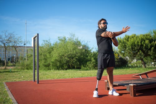 Photos gratuites de désactivée, échauffement, entraînement