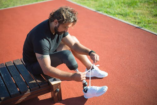 A Man Tying a Shoe