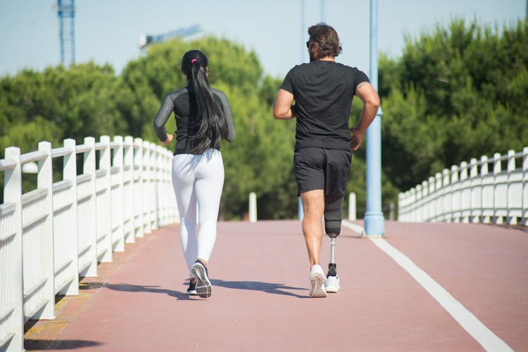 A Man And Woman Running 