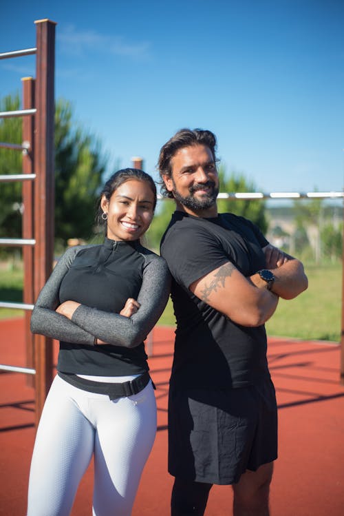 Free A Man and a Woman Standing in the Exercise Yard Stock Photo