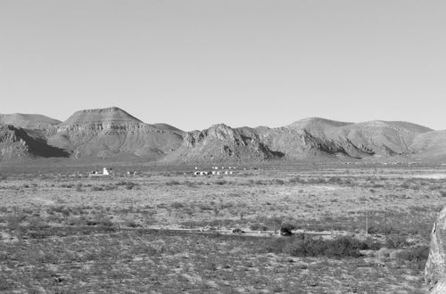 Free Explore the arid beauty of a mountain landscape in black and white, showcasing rugged terrain. Stock Photo