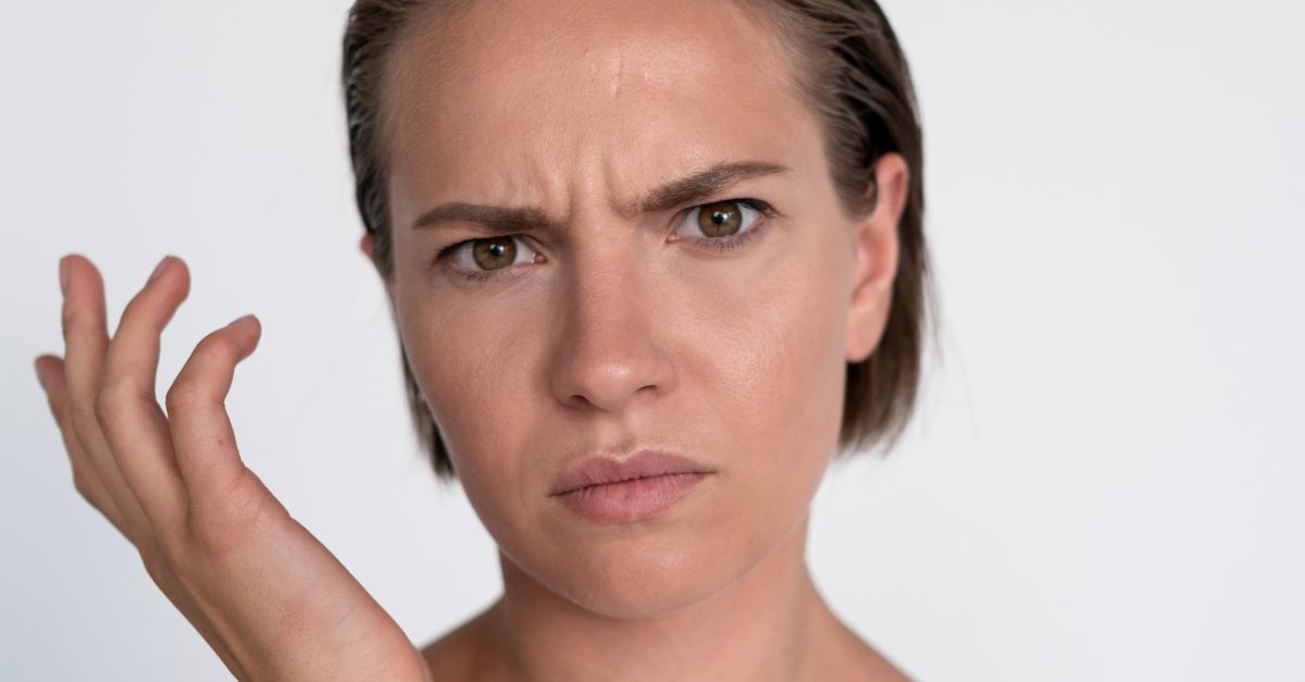 A Portrait of a Woman with a Confused Facial Expression · Free Stock Photo