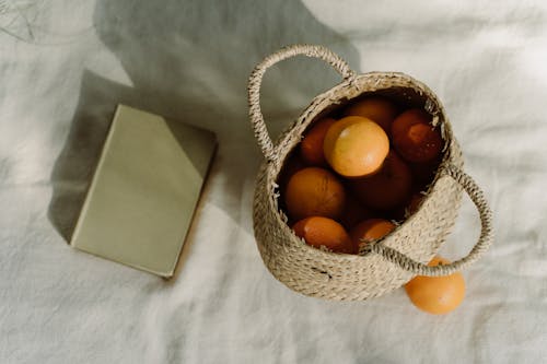 Orange Fruits in a Brown Woven Basket
