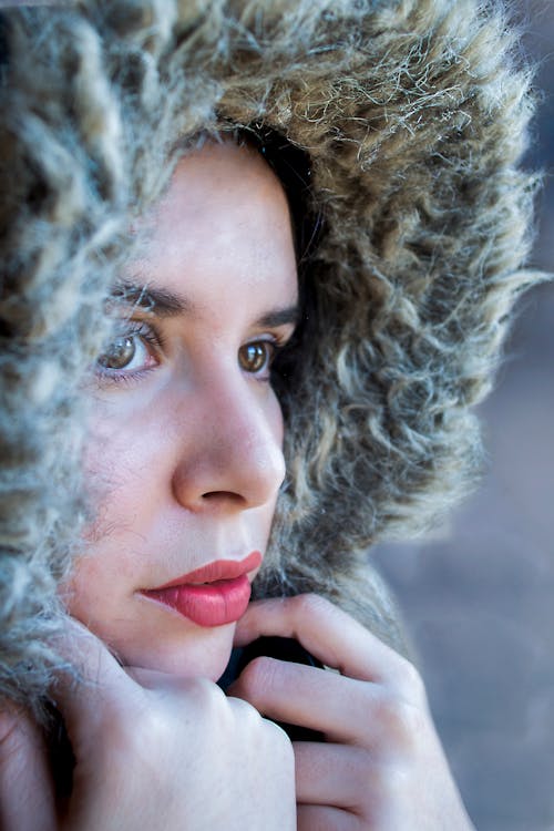 A Close-up Shot of a Woman in Fur Hoodie