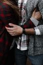 Man and Woman In Plaid Shirts Hugging Each Other