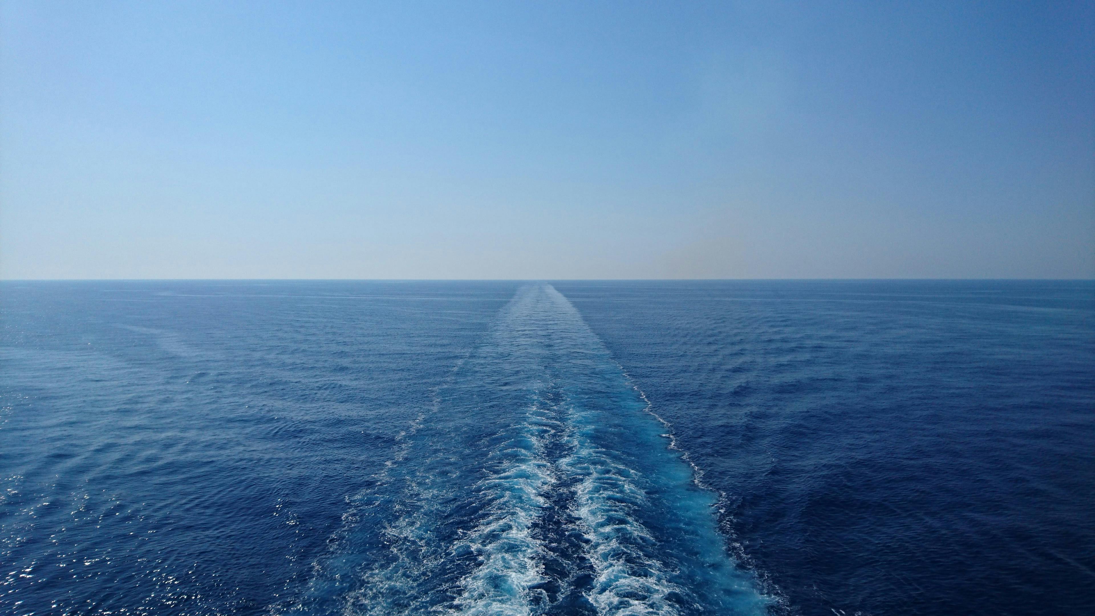 A serene ocean scene with a ship