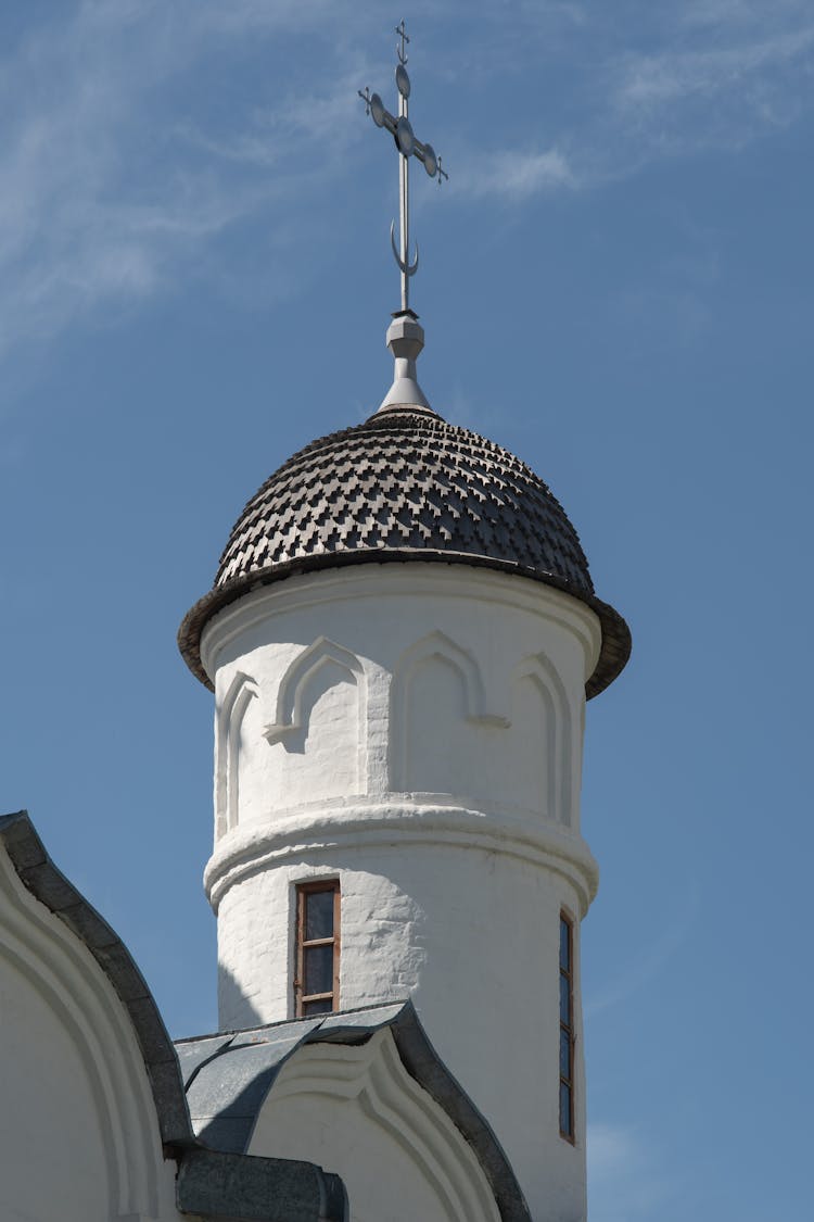 A White And Gray Church Building Under The Blue Sky 